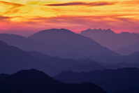 Sunset over hills of croatian Zagorje region and mountains of Slovenia in the background, Zagorje, Croatia