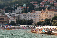 People swimming in front of popular resort Opatija, Kvarner, Croatia