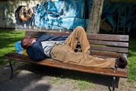 Man sleeping on the bench in the city of Zagreb, Croatia