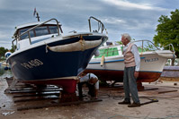 Man working on the boat in shipyard, island Ugljan, Dalmatia, Croatia